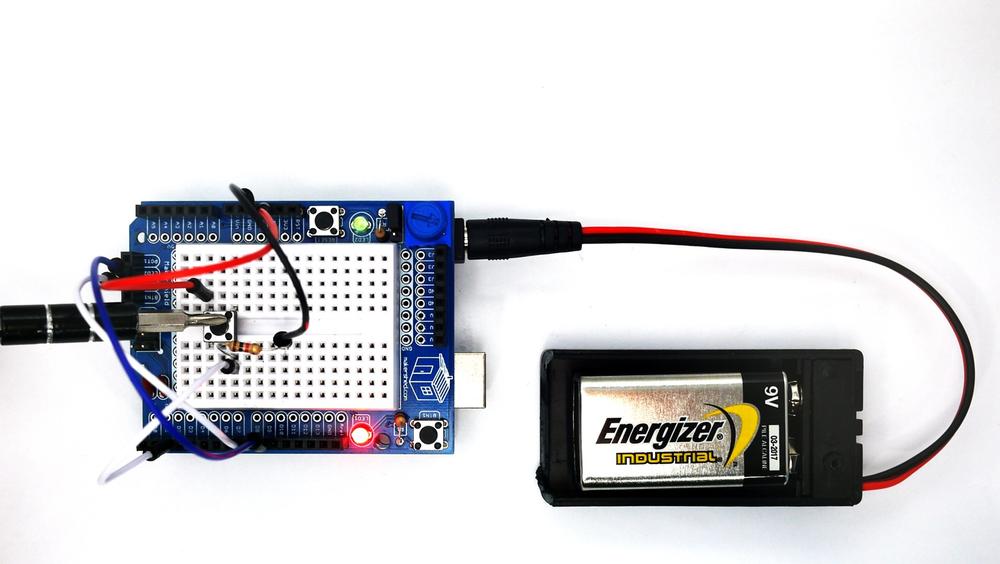 The Arduino NOT Logic Gate: pressing the pushbutton switch turns on the red LED (FALSE output)